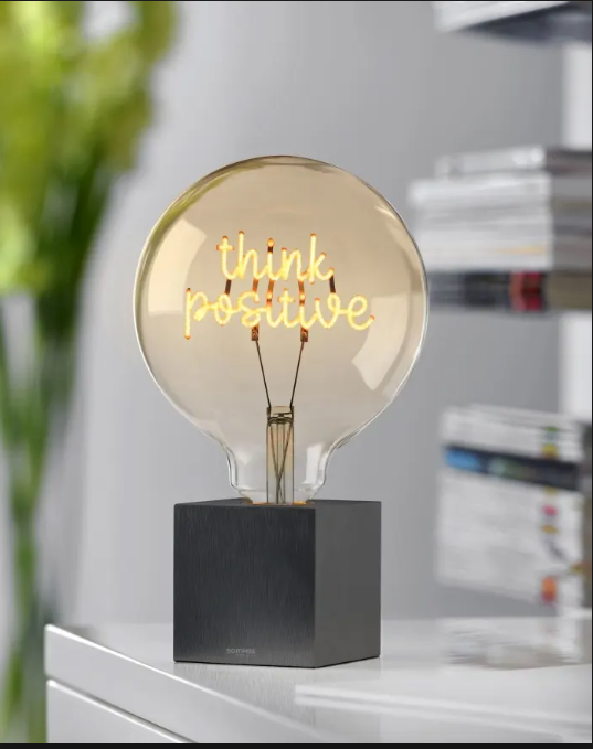 standing lamp beside single gray chair