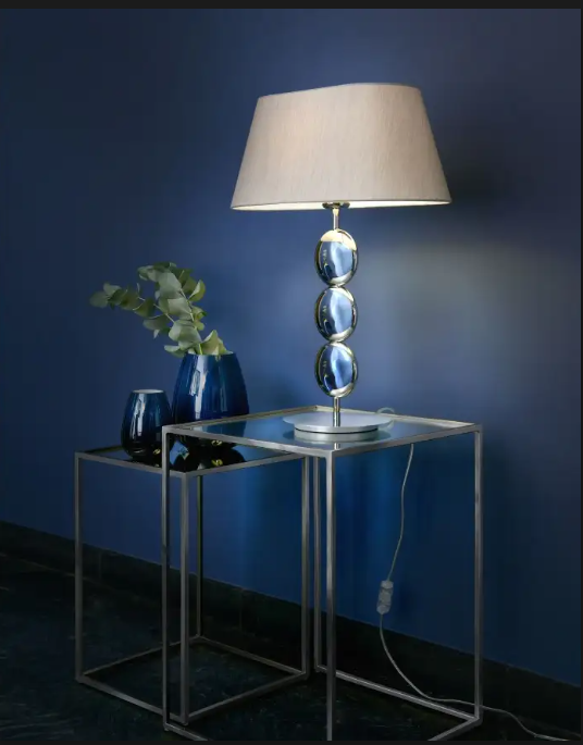 standing lamp beside single gray chair